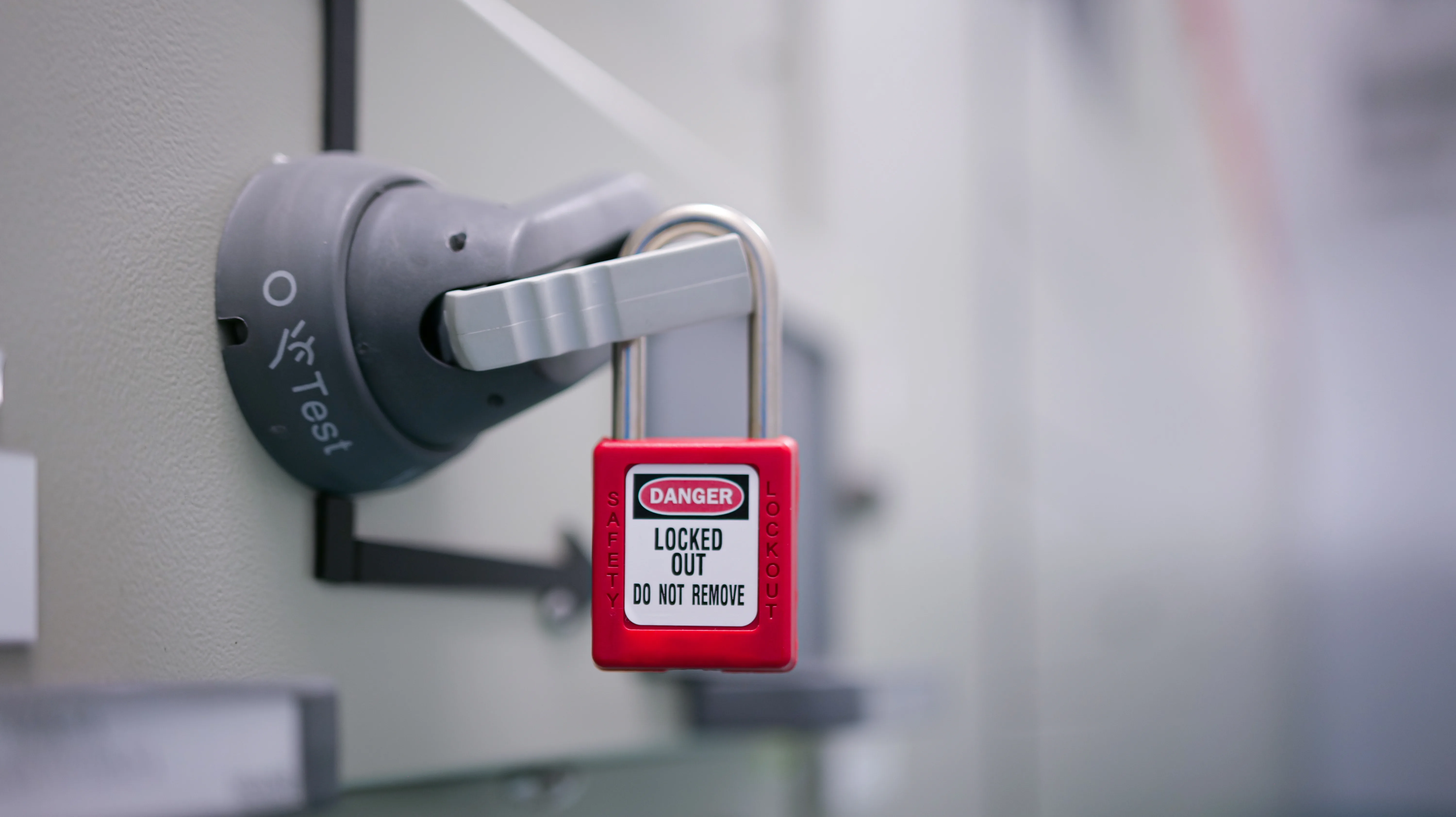 A swith that has been fitted with a lockout lock to prevent the equipment from being energized.