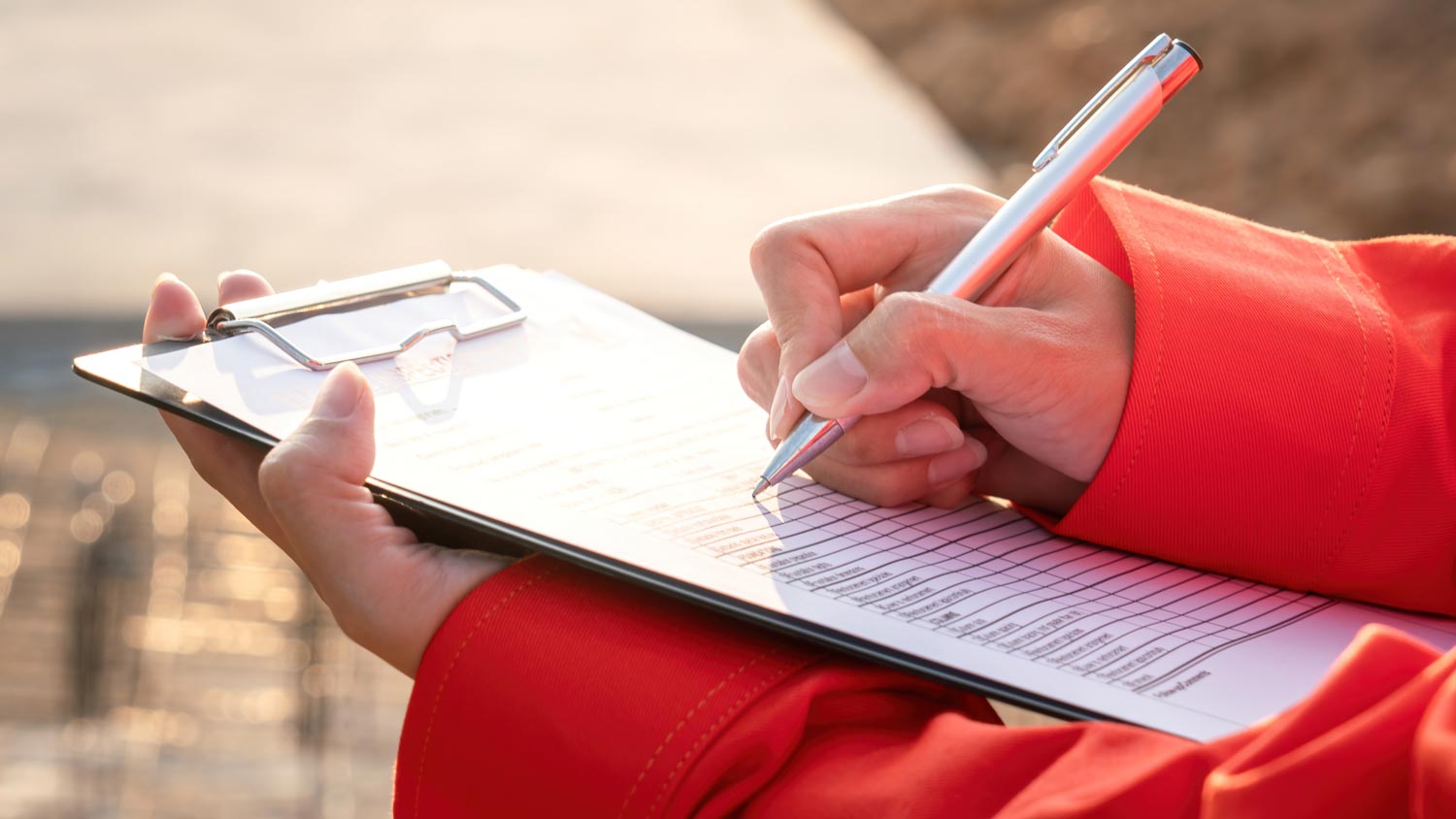 Crane operator writing on clipboard