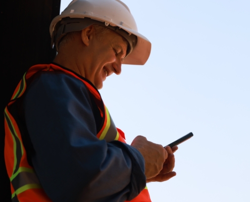 Man in high vis with phone cropped
