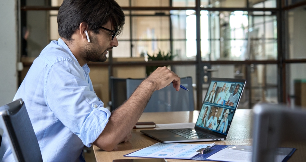 Indian corporate leader manager leading virtual business team work meeting.