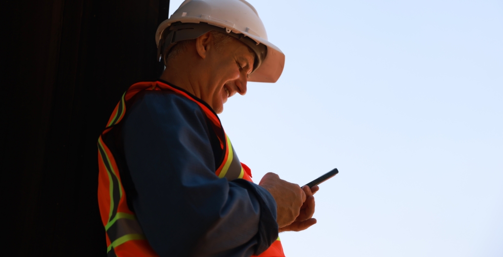 Man in high vis with phone cropped